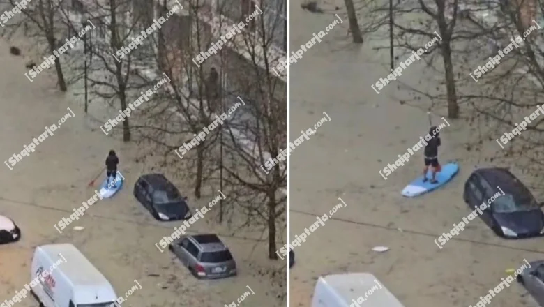 Iznad daske od pjene i lopate u rukama, građanin plovi ulicama Drača (VIDEO)